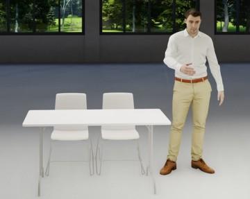 Mies seisoo pöydän vieressä